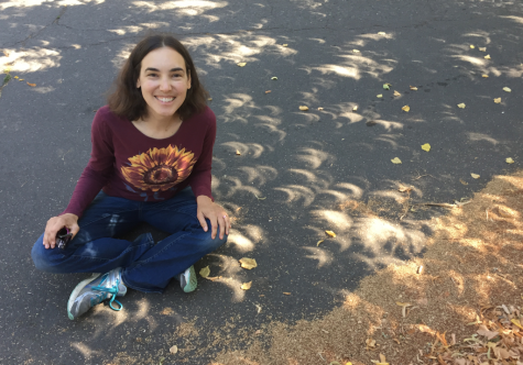 Ms Tock, an instructor at the OHS, pursues astronomy beyond her classes as she sits among crescents of the sun during the August 2017 eclipse.