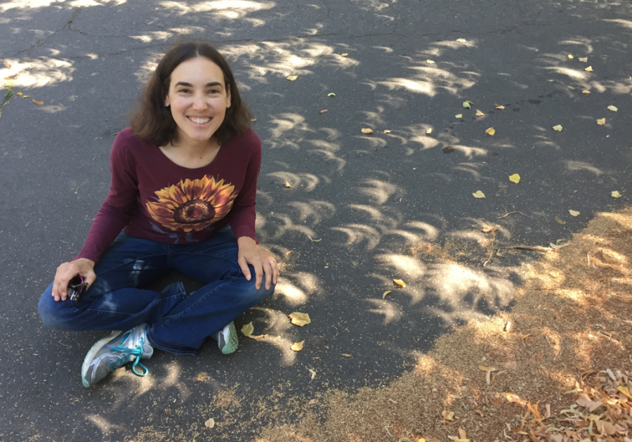 Ms Tock, an instructor at the OHS, pursues astronomy beyond her classes as she sits among crescents of the sun during the August 2017 eclipse.