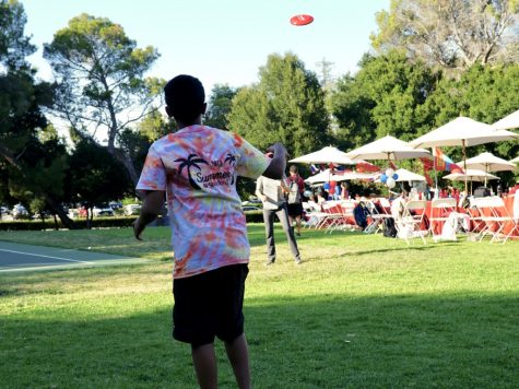 An OHSer throws a frisbee with Dr. Steele during Summer @ Stanford