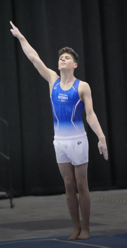 Antonio at one of his gymnastics meets, tall and proud.