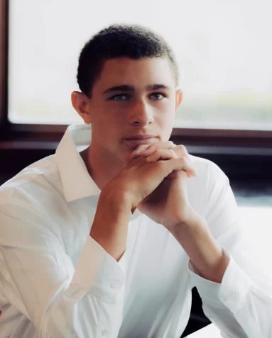 Aston Daviess picture reflects the thoughtfulness he puts into his work at the Humanitarian Weekly.