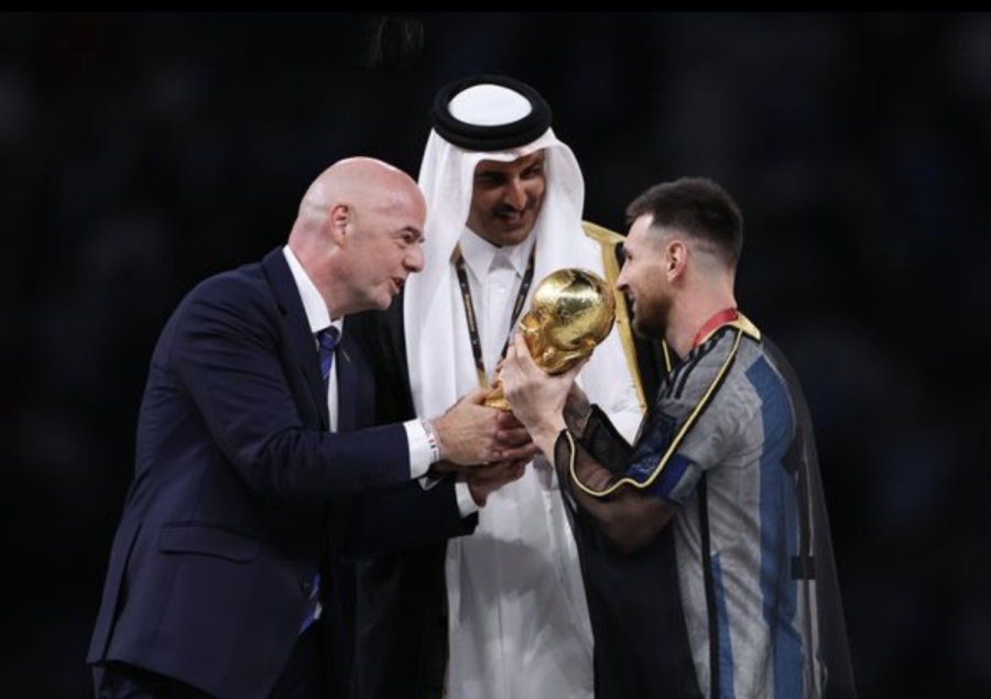 FIFA+President+Giovanni+Infantino+and+Qatari+Emir+Sheikh+Tamim+bin+Hamad+Al+Thani+hand+the+World+Cup+to+Lionel+Messi+and+champions+Argentina.
