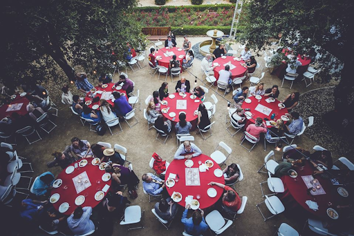 The image captures a scene where OHS students and professors are savoring a delightful evening brunch as part of the Pixel Gathering and Graduation festivities. 
