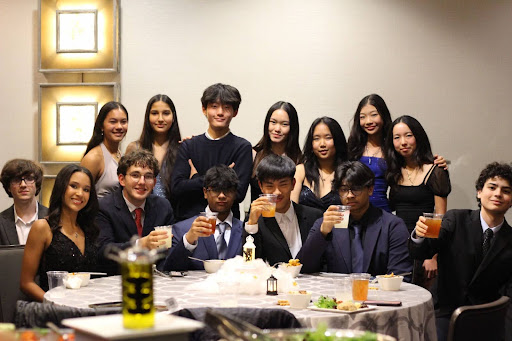 Students gathered to enjoy a quick dinner together before the dance. Photograph by Beatrice Pook. 